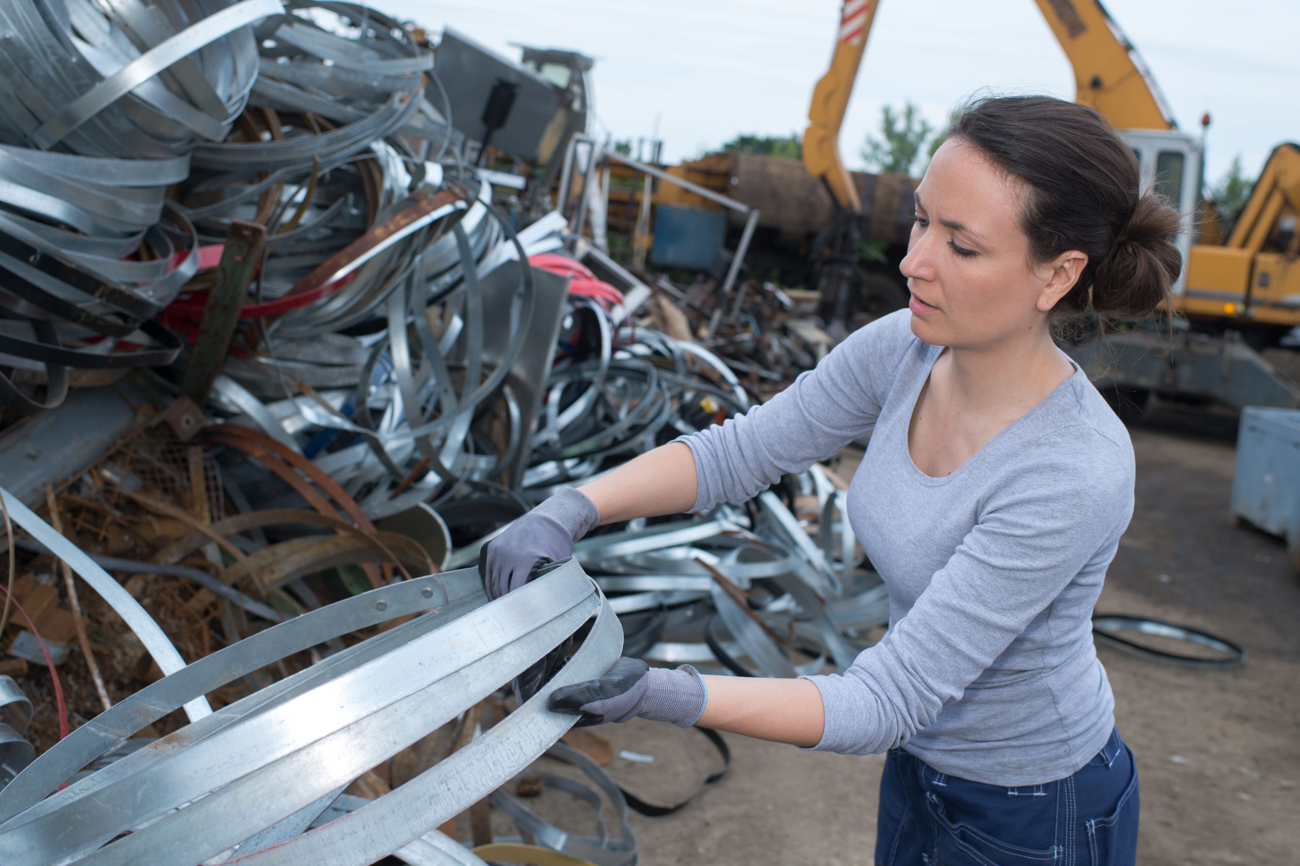 woman at a junkyard