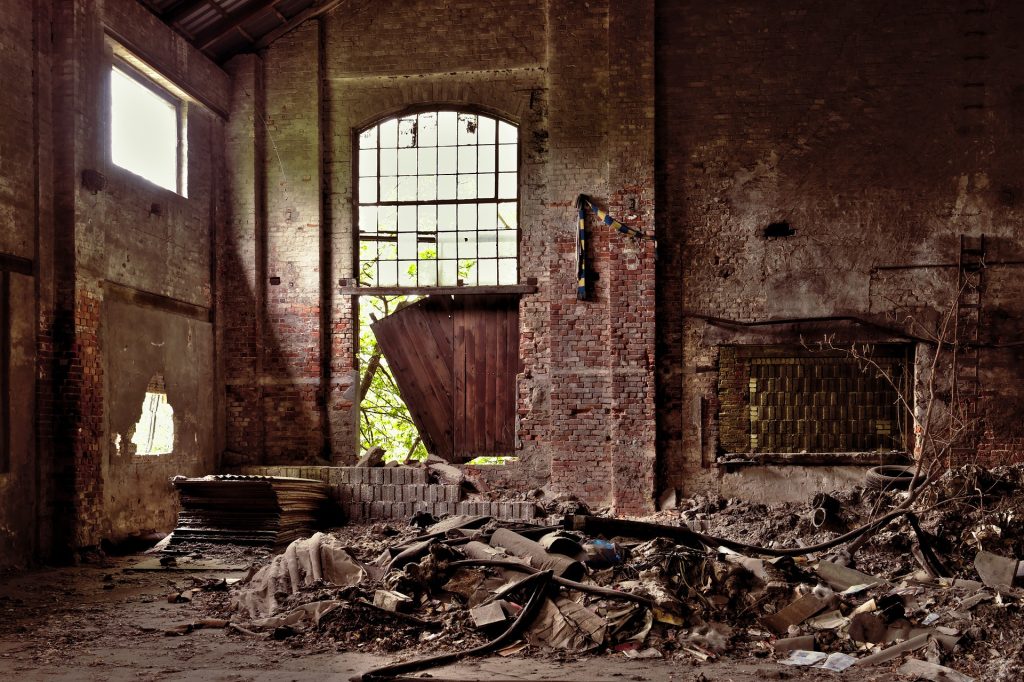 A large room with a bunch of debris on the floor